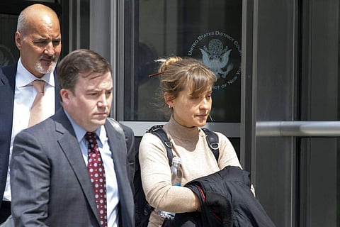 Actress Allison Mack leaves Brooklyn federal court in New York. (AP Photo/Mark Lennihan)