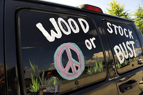 File photo: A van decorated with Woodstock or Bust. (AP Photo/Stephen Chernin)