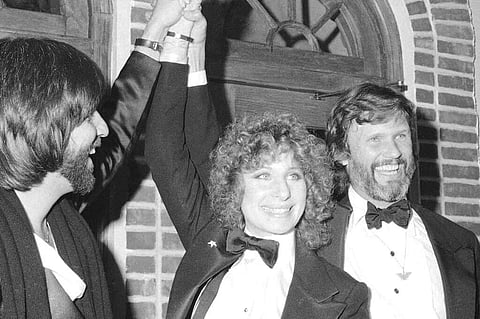 1976 file photo: producer Jon Peters, Barbra Streisand and Kris Kristofferson at a preview of A Star is Born (AP Photo/Suzanne Vlamis)