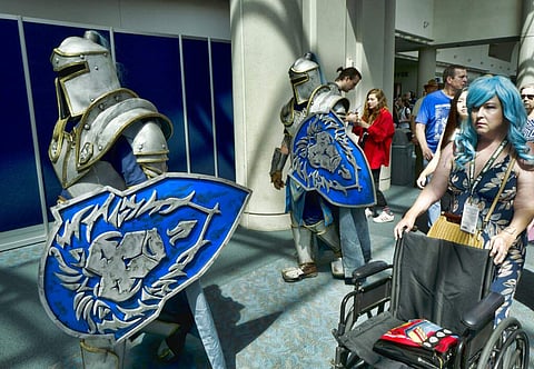 Michael Mijerark and Ryan Trent dress as knights from Warcraft at Comic-Con, San Diego. (AP Photo/Richard Vogel, File)