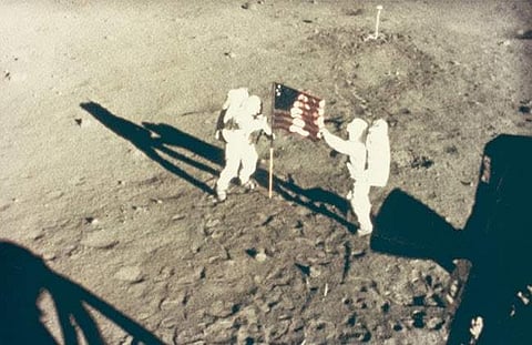 NASA's Neil Armstrong and Buzz Aldrin deploy US flag on the Moon, July 20, 1969 (Credit: National Gallery of Art, Washington, Gift of Mary and Dan Solomon)