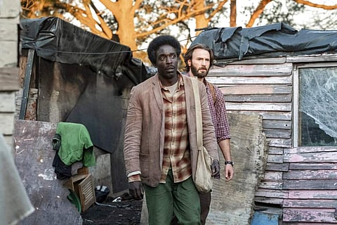 Michael Kenneth Williams and Chris Evans in The Red Sea Diving Resort (Marcos Cruz/Netflix via AP)