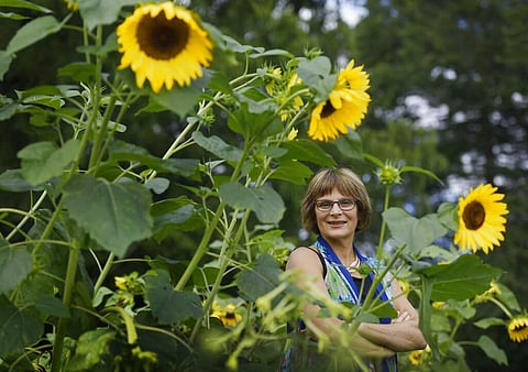 Karen Breda in a garden in West Hartford, Conn (AP Photo/Jessica Hill)