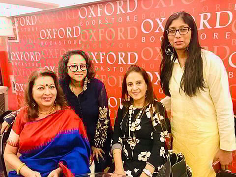The panelist pose after the discussion at Oxford Bookstore