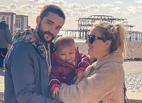 Tom Parker with his wife and child.