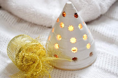 Golden wrapped jar in a miniature candle from Illumine Lights