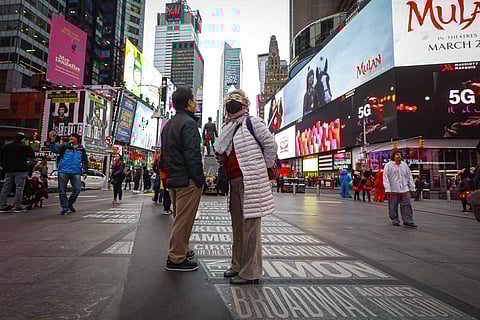 At Times Square, New York (AP Photo/John Minchillo)