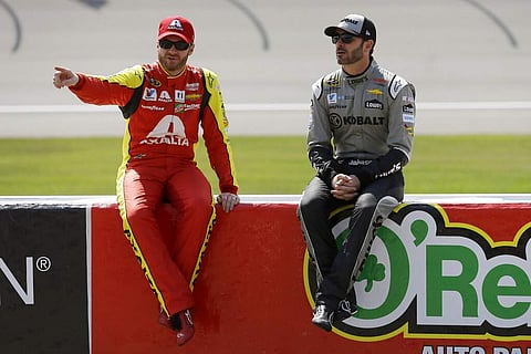 File photo: Drivers Dale Earnhardt Jr and Jimmie Johnson (AP Photo/Carlos Osorio, File)
