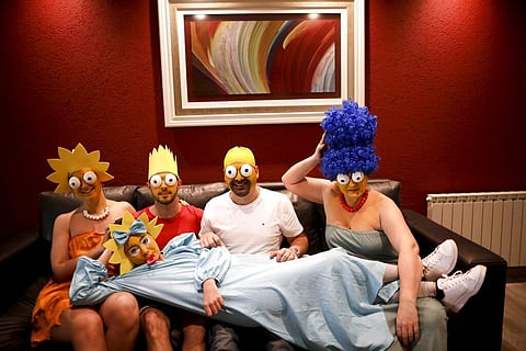 The Arevalo-Robledo family, dressed as The Simpsons (AP Photo/Natacha Pisarenko)