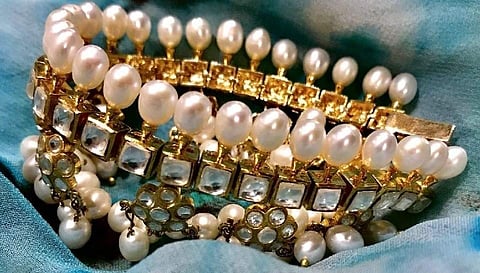 Pearls & Diamonte white and gold cuffs by Gauri Himatsingka