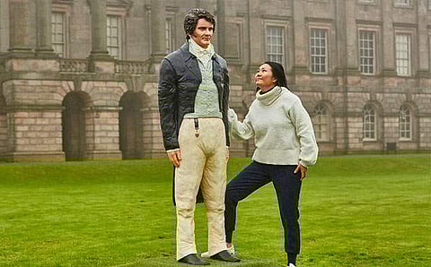 Michelle Wibowo with the life-size cake version of Colin Firth's Mr Darcy. Image courtesy: Michelle's website