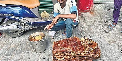 An apiarist selling honey in Landour, Uttarakhand