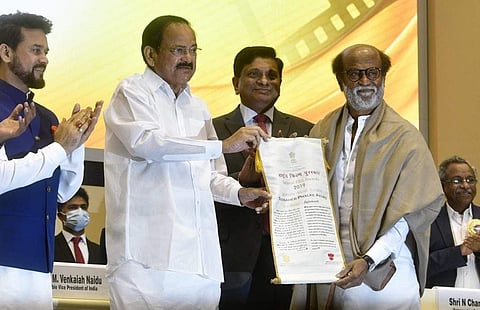 Rajinikanth receives the Dadasaheb Phalke awrd from Vice-President Venkaiah Naidu