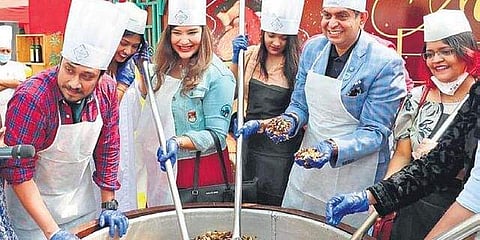 Guests participate in a cake mixing session at Novotel Hyderabad