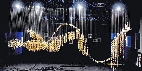 Tensing's art installation of a newborn child created using 1,500 small pieces of wooden blocks hanging on nylon fishing lines