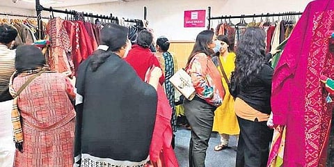 Customers browsing through various products at the Pause for a Cause exhibition at Aga Khan Hall.