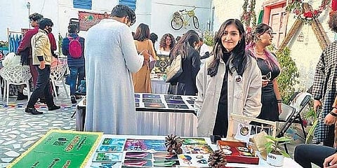 An artist selling their artworks at the event.