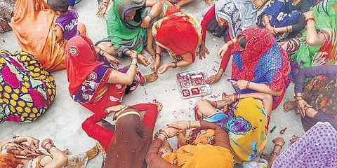 A group of women at a feast for a deceased person