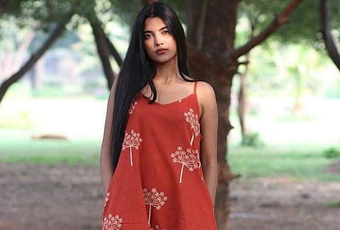 A red asymmetrical dress by Chidiyaa