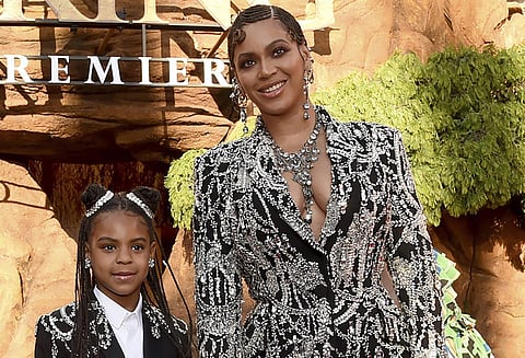 FILE - Beyonce, right, and her daughter Blue Ivy Carter arrive at the world premiere of 'The Lion King' in Los Angeles on July 9, 2019. Blue Ivy's name was added to the nominee list for best music vid