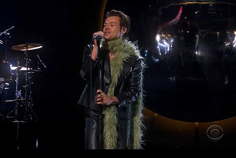 Harry Styles takes a Grammy home. Image Source: AP/CBS