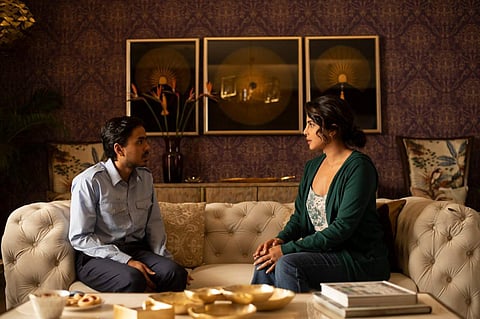 A still from The White Tiger featuring Adarsh Gourav and Priyanka Chopra Jonas
