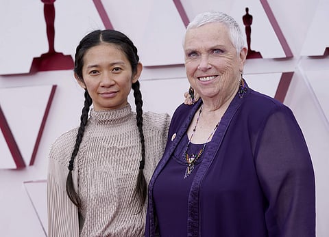 Director Chloé Zhao with Nomadland actor Charlene Swankie, Picture credit: AP