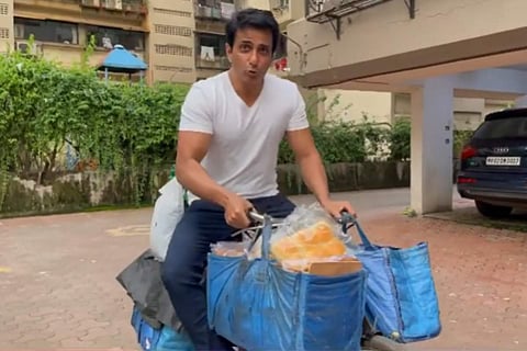 Sonu Sood posts a video where he is seen sitting on a bicycle loaded with groceries