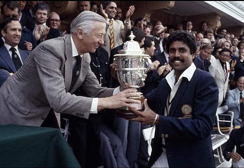 Kapil Dev receives the trophy from Robert Carr. Image courtesy: Indian Cricket Team's Instagram account