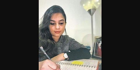 Natali Manocha journaling her thought