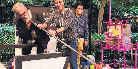 One of Glass Sutra’s patrons glassblowing