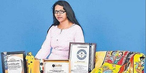 Fashion designer Neethu Krishnan hand-painted a total of 68 Indian folk-art forms on a six-yard long handloom saree