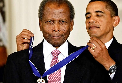 President Barack Obama presents the 2009 Presidential Medal of Freedom to Sidney Poitier during ceremonies in the East Room at the White House in Washington on, Aug. 12, 2009. (Photo: AP)