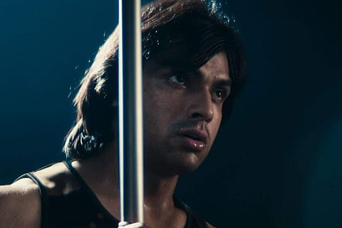 Neeraj can be seen wearing dark athletic attire and throwing a javelin in the video