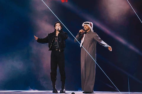 Jung Kook with Fahad Al Kubaisi at the FIFA World Cup 2022 opening ceremony