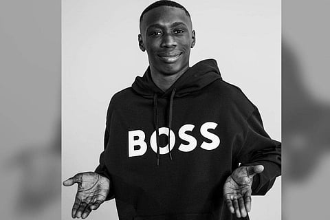 Khaby Lame in his iconic pose