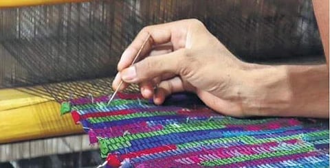 An artisan working with discarded fabric at the Paiwand studio in Noida
