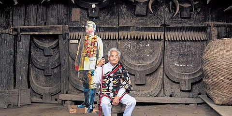 Poswuyi Swuro near a Netaji cutout in the house where the INA chief stayed for nine days,Photographs by mongmei L Phom