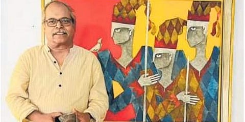 Artist Ashok Bhowmick with his artwork.