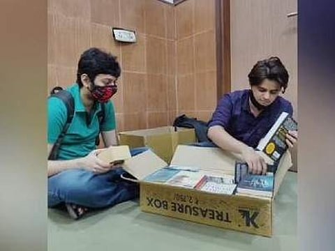 Visitors load their books in the box.