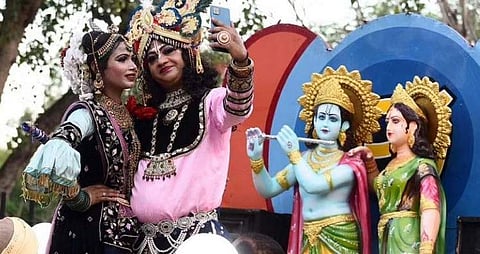 Artists dressed up as Lord Krishna and Radha participate in a Janmashtami procession at the Laxmi Narayan Temple in New Delhi. (Photo | Parveen Negi, EPS)