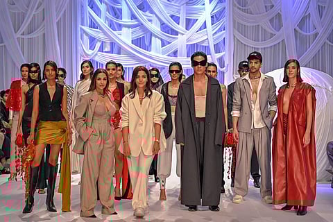 Malaika Arora (biege) and Shweta Kapur (white) along with models during the launch of Kapur's latest edit