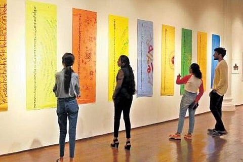 Visitors check out calligraphy exhibits at Durbar Hall Gallery in Kochi