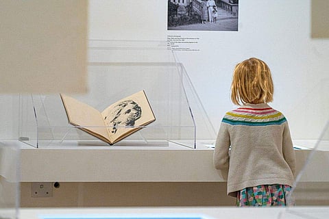 A girl observes part of the Picasso: 14 Sketchbooks exhibit at Pace Gallery in New York