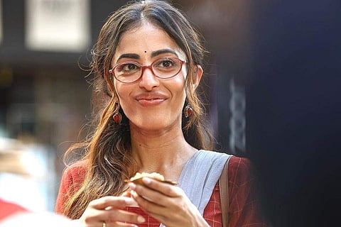 Priya, decked up as her Chaalchitro character gets ready to grab a bite of phuchka