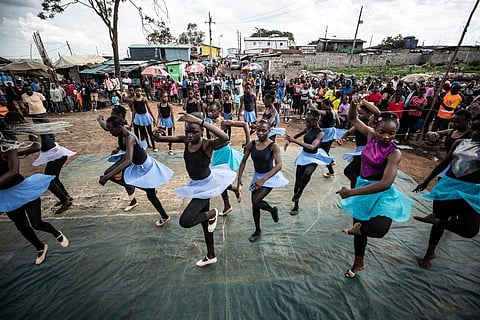 Young dancers perform, during a Christmas ballet event in Kibera