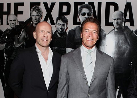 (L-R) Bruce Willis and Arnold Schwarzenegger