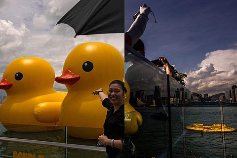 18-meter-tall yellow ducks by Dutch artist Florentijn Hofman resemble the bath toys many played with in their childhood