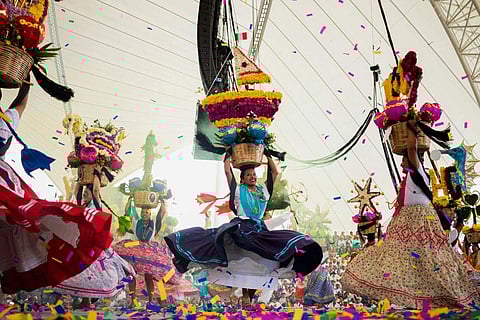 Dancers perform on the first day of the Guelaguetza in Oaxaca, Mexico