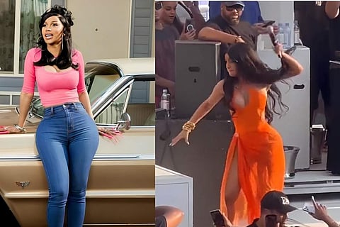 Despite getting hit with the water, Cardi paused only momentarily while performing